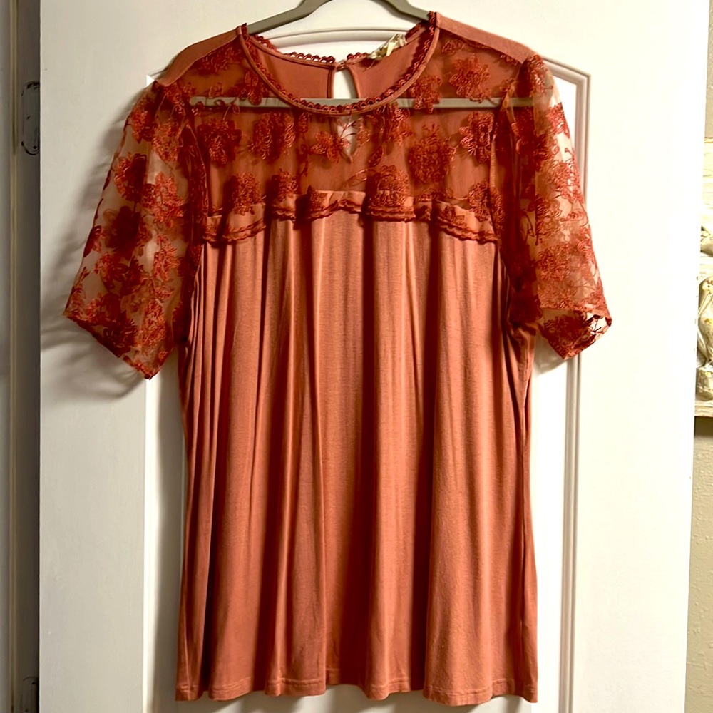 Peach sheer sleeve shirt.